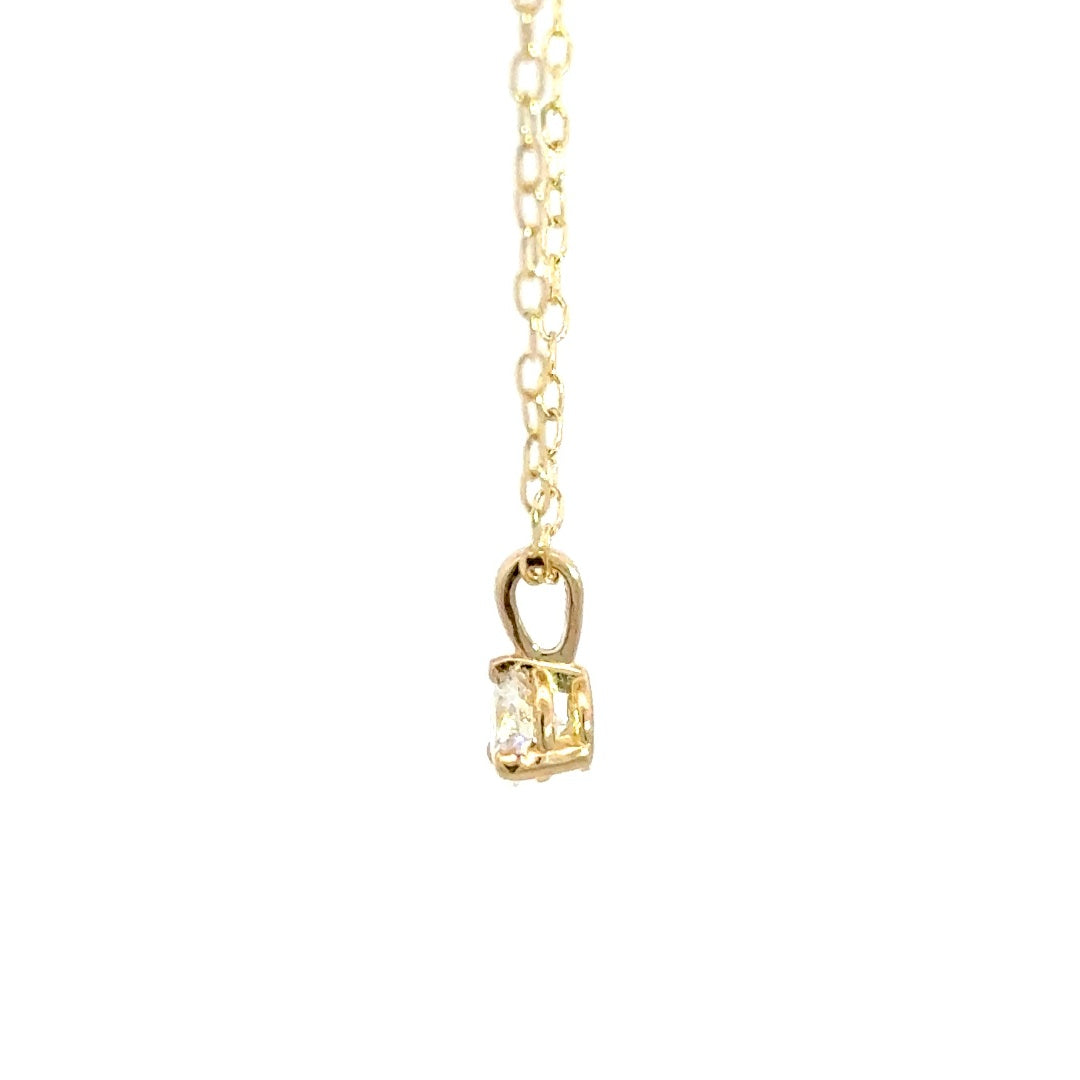 Yellow gold diamond necklace on a white background.