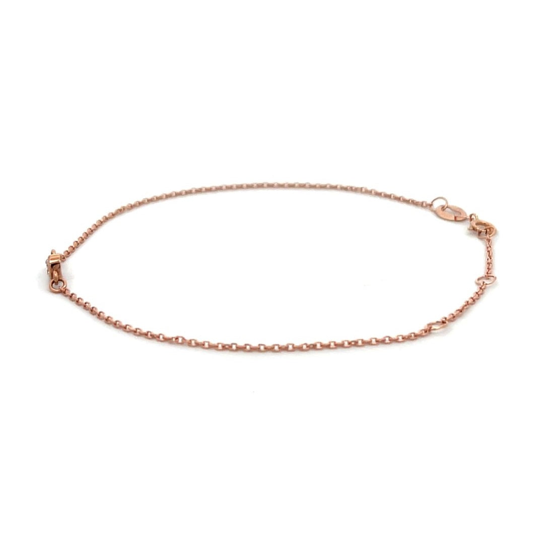 Rose gold bracelet with a single diamond on a white background.