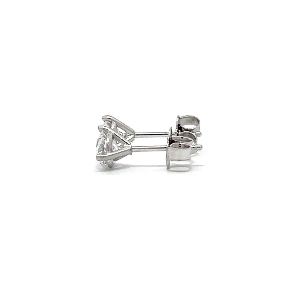 White gold stud earrings with round diamonds on a white background.