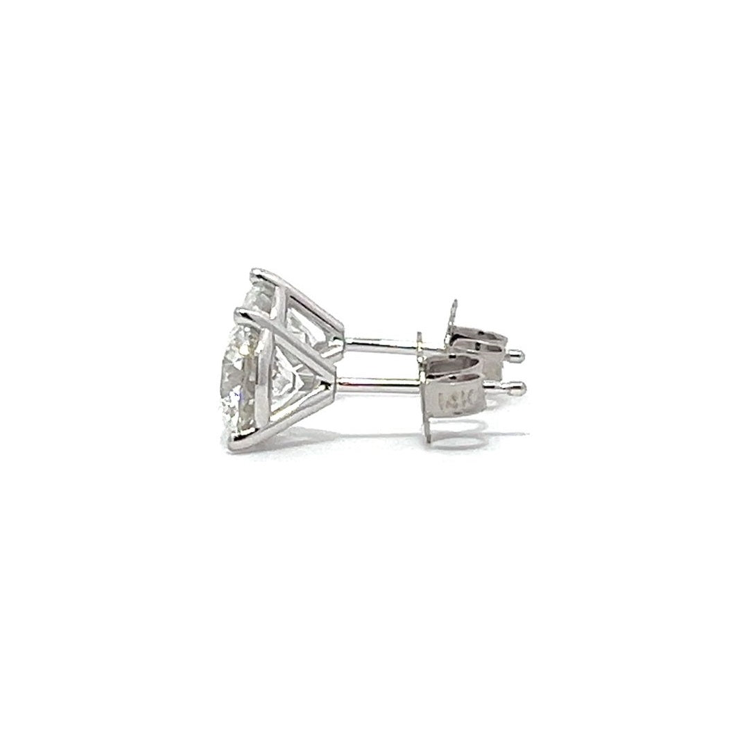 White gold stud earrings with round diamonds on a white background.