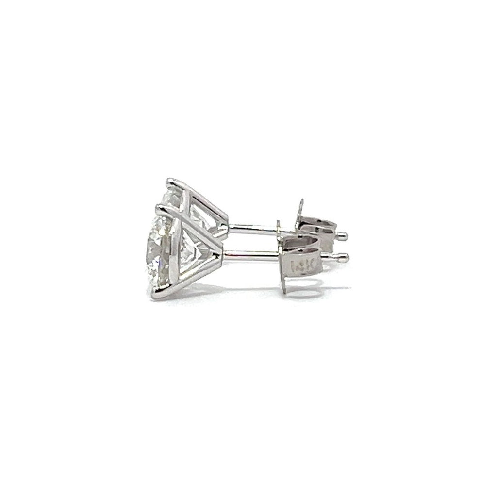 White gold stud earrings with round diamonds on a white background.