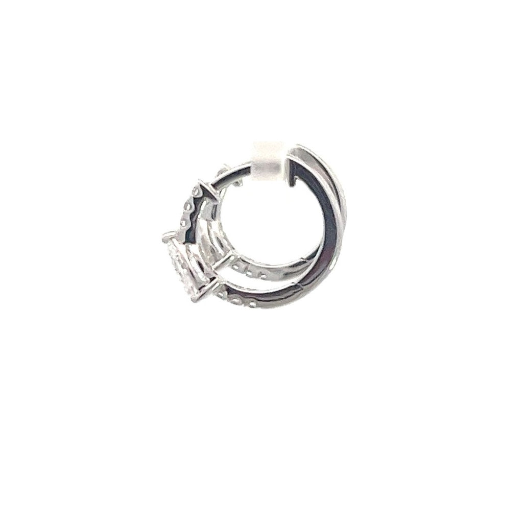 SIlver hoop earrings with round diamonds on a white background.