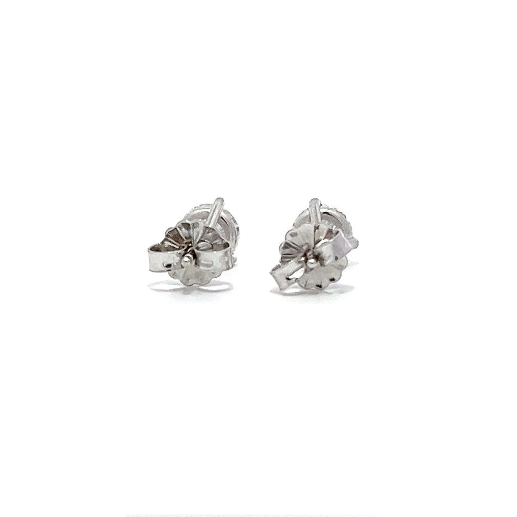 White gold stud earrings with round diamonds on a white background.