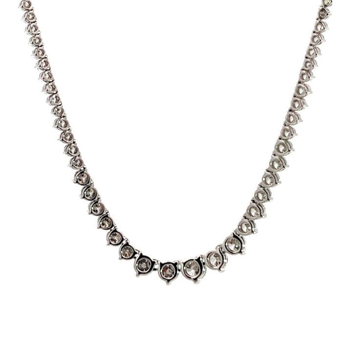 White gold diamond tennis necklace on a white background.