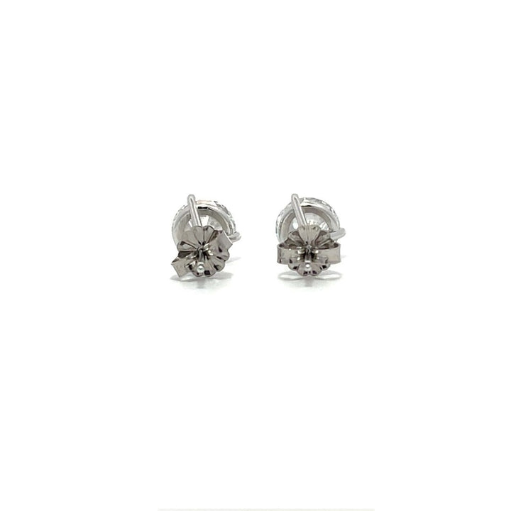 White gold stud earrings with round diamonds on a white background.