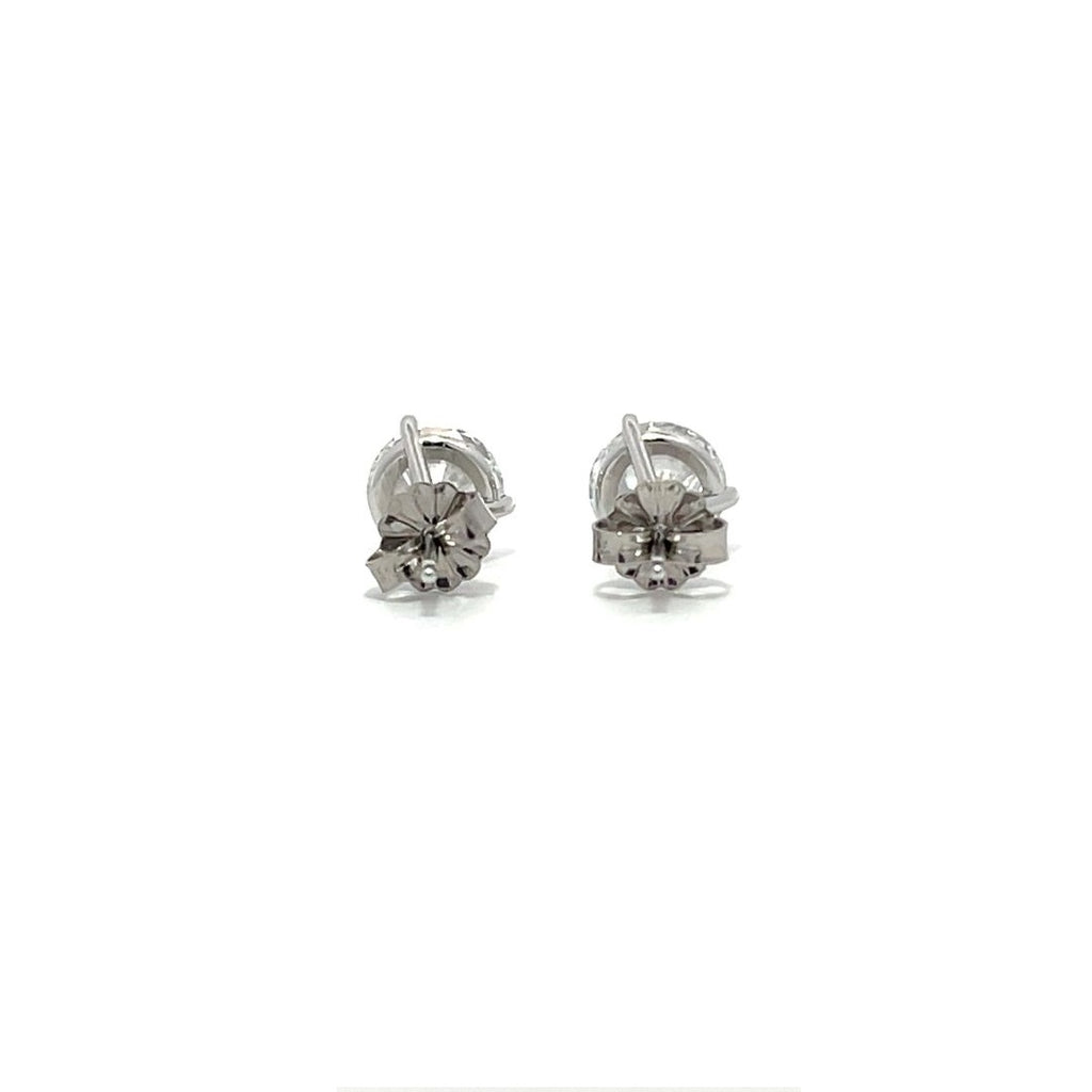 White gold stud earrings with round diamonds on a white background.