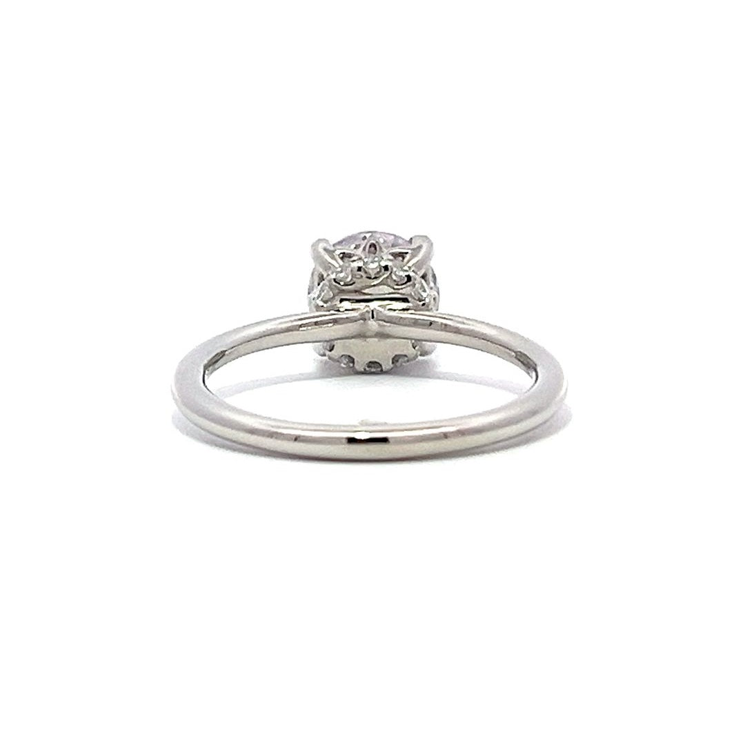 White gold diamond solitaire engagement ring on a white background.