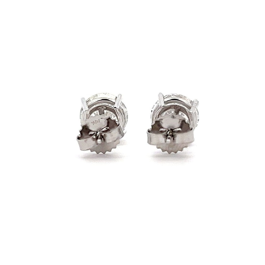 White gold stud earrings with round diamonds on a white background.