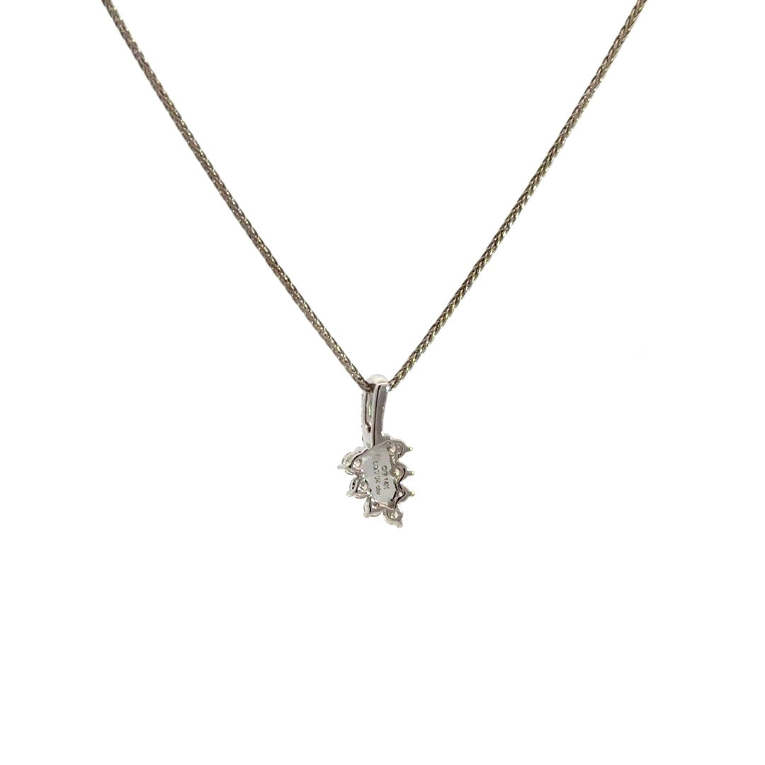 Diamond leaf pendant necklace on a white background