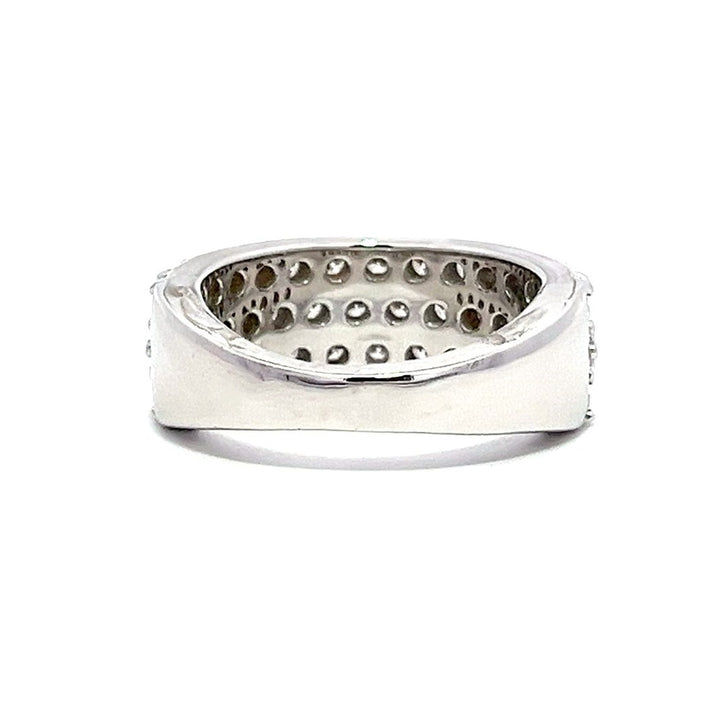 White gold eternity band with three rows of pave-set diamonds on a white background.