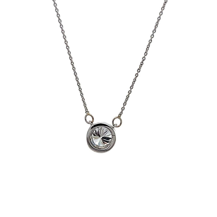 White gold necklace with a round diamond solitaire pendant on a white background.