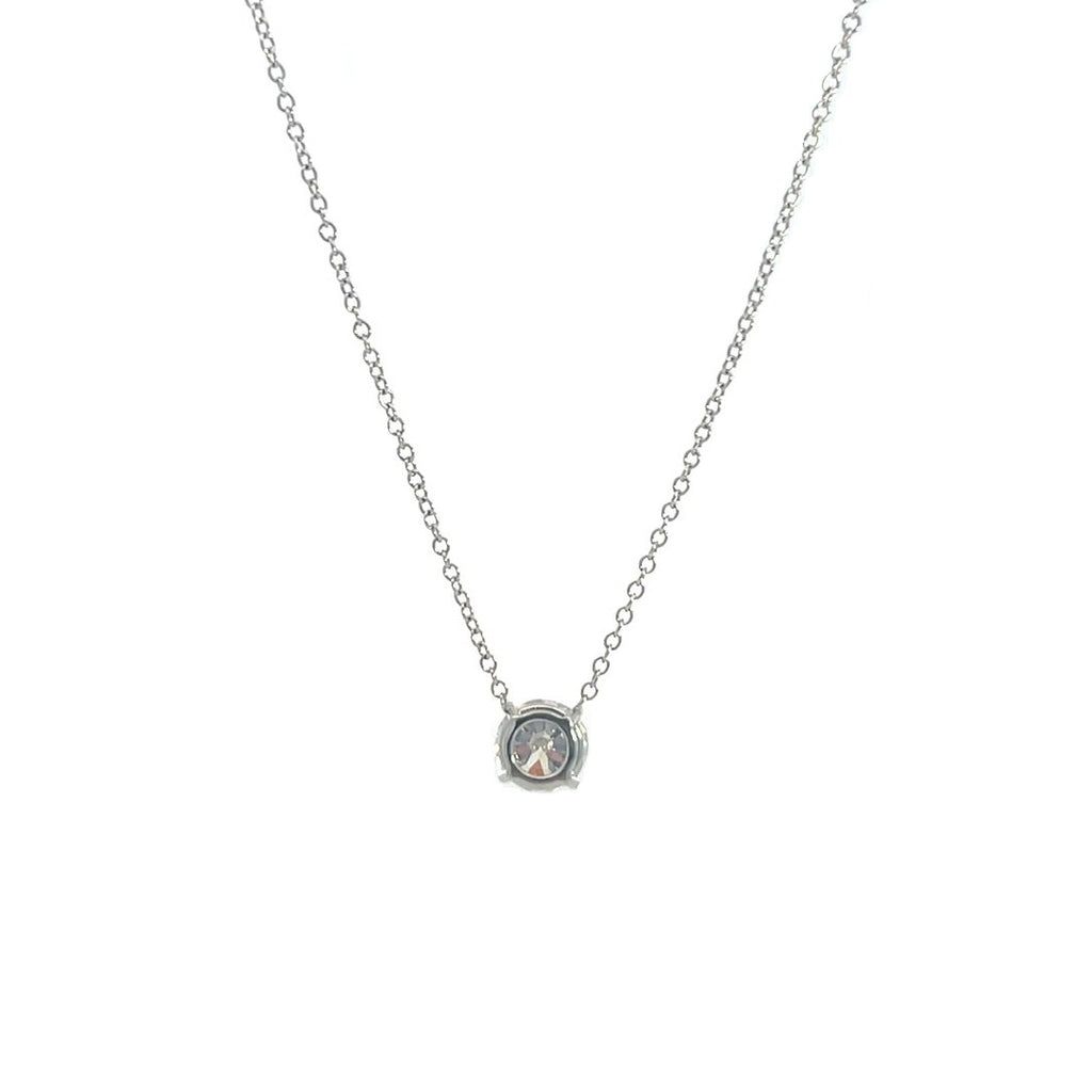 Silver necklace with a round diamond solitaire pendant on a white background.