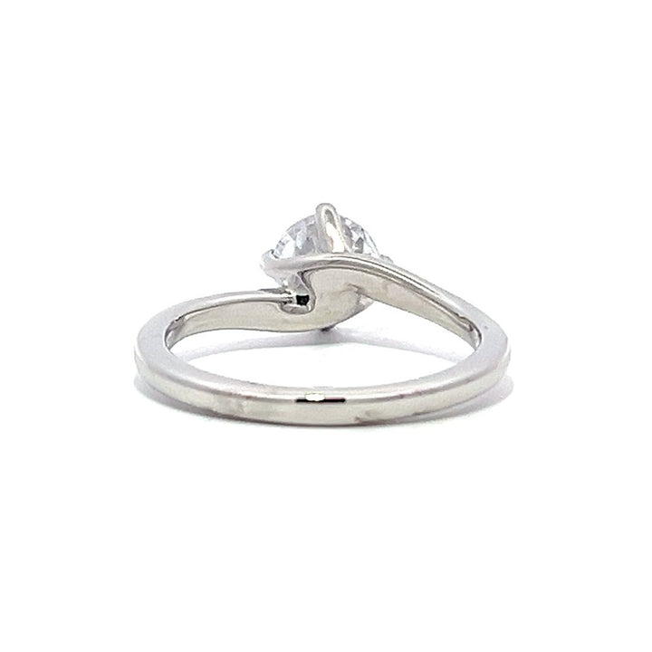 White gold round diamond solitaire engagement ring on a white background.