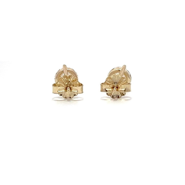 Yellow gold stud earrings with round diamonds on a white background.