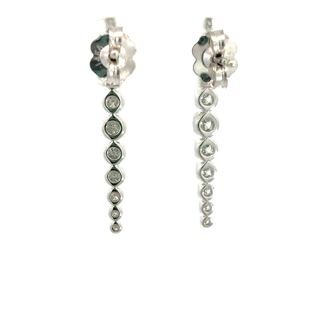 Diamond drop earrings on a white background