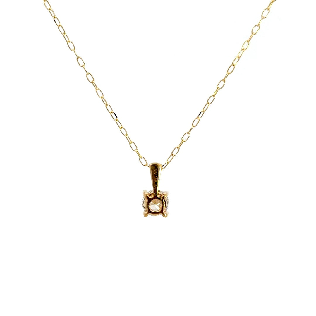 Yellow gold diamond solitaire necklace on a white background.