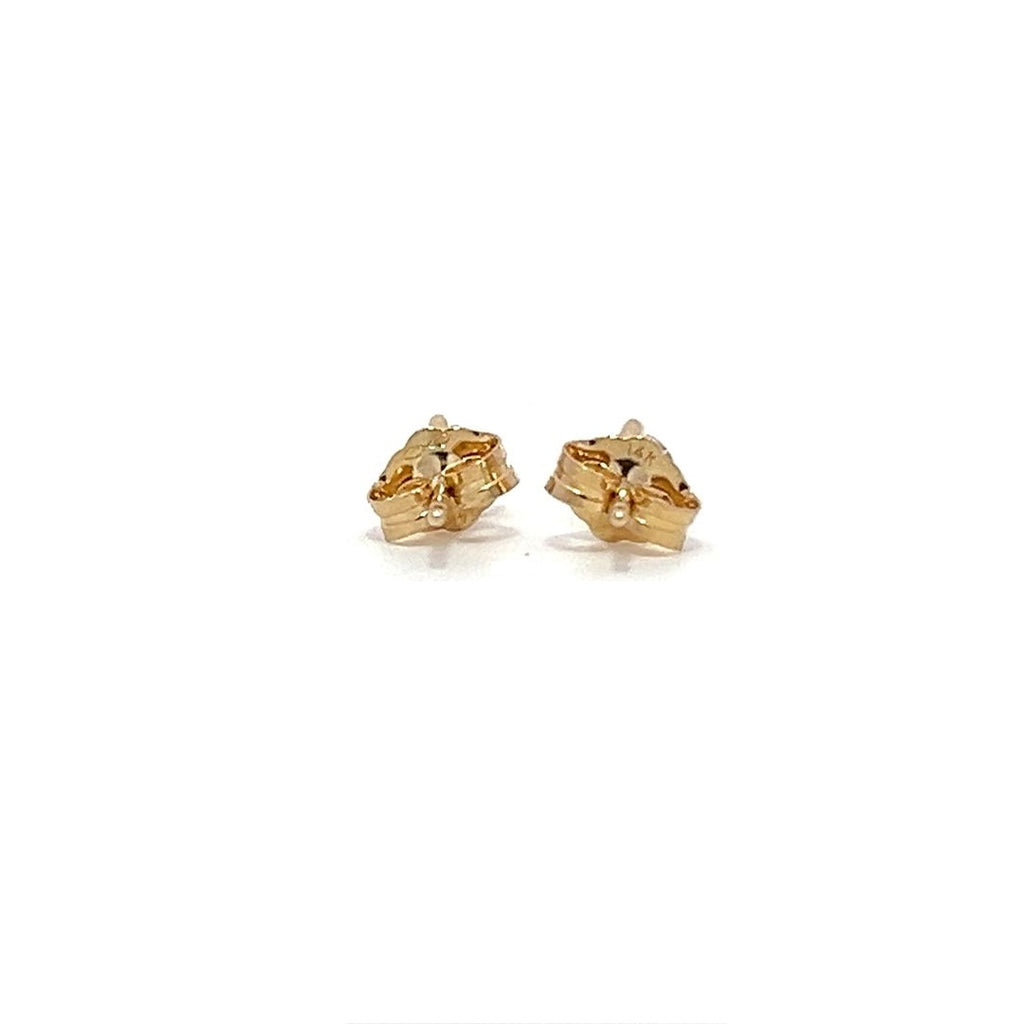 Pair of yellow gold stud earrings with a triangular setting of diamonds on a white background.