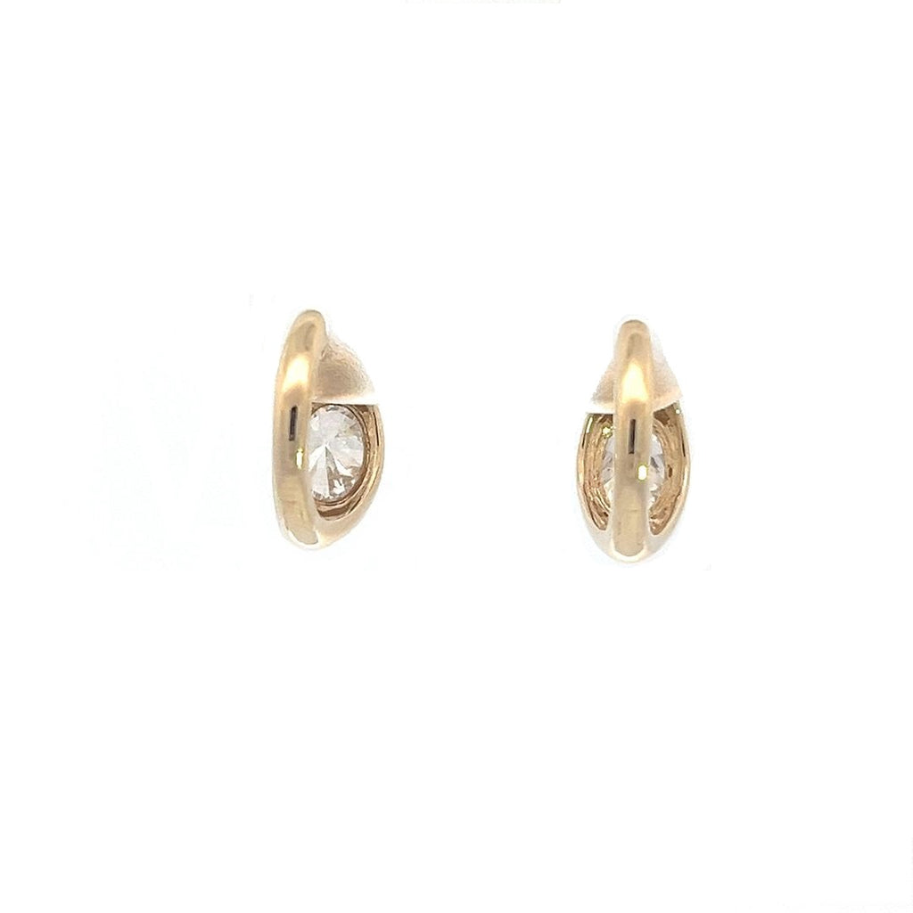 Yellow gold drop earrings with round diamonds in a pear-shaped setting, on a white background.