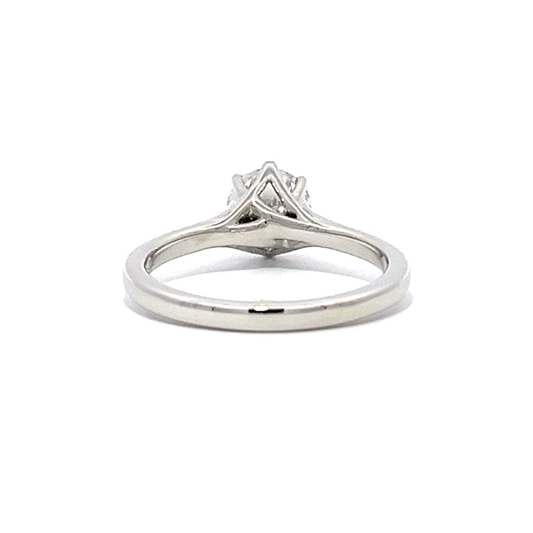 White gold round diamond solitaire engagement ring on a white background.