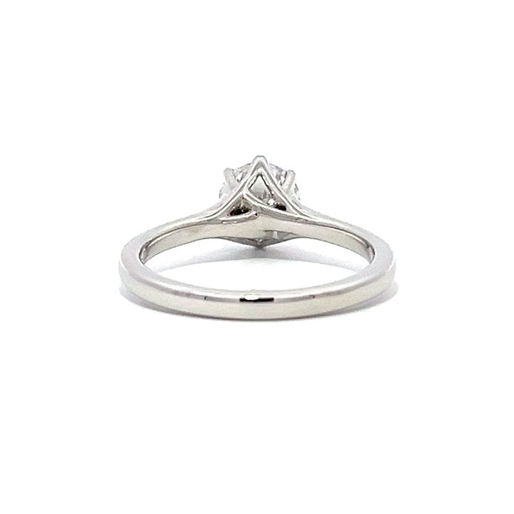 White gold round diamond solitaire engagement ring on a white background.