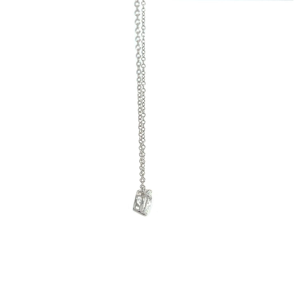 Silver necklace with a round diamond solitaire pendant on a white background.