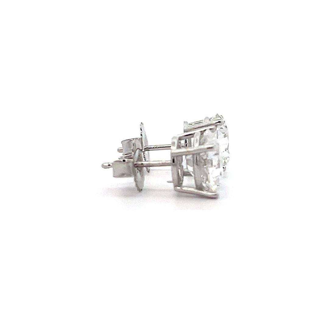 White gold stud earrings with round diamonds on a white background.