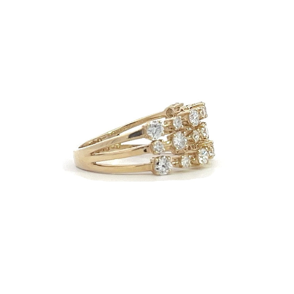 Yellow gold ring with three rows of diamonds, on a white background.