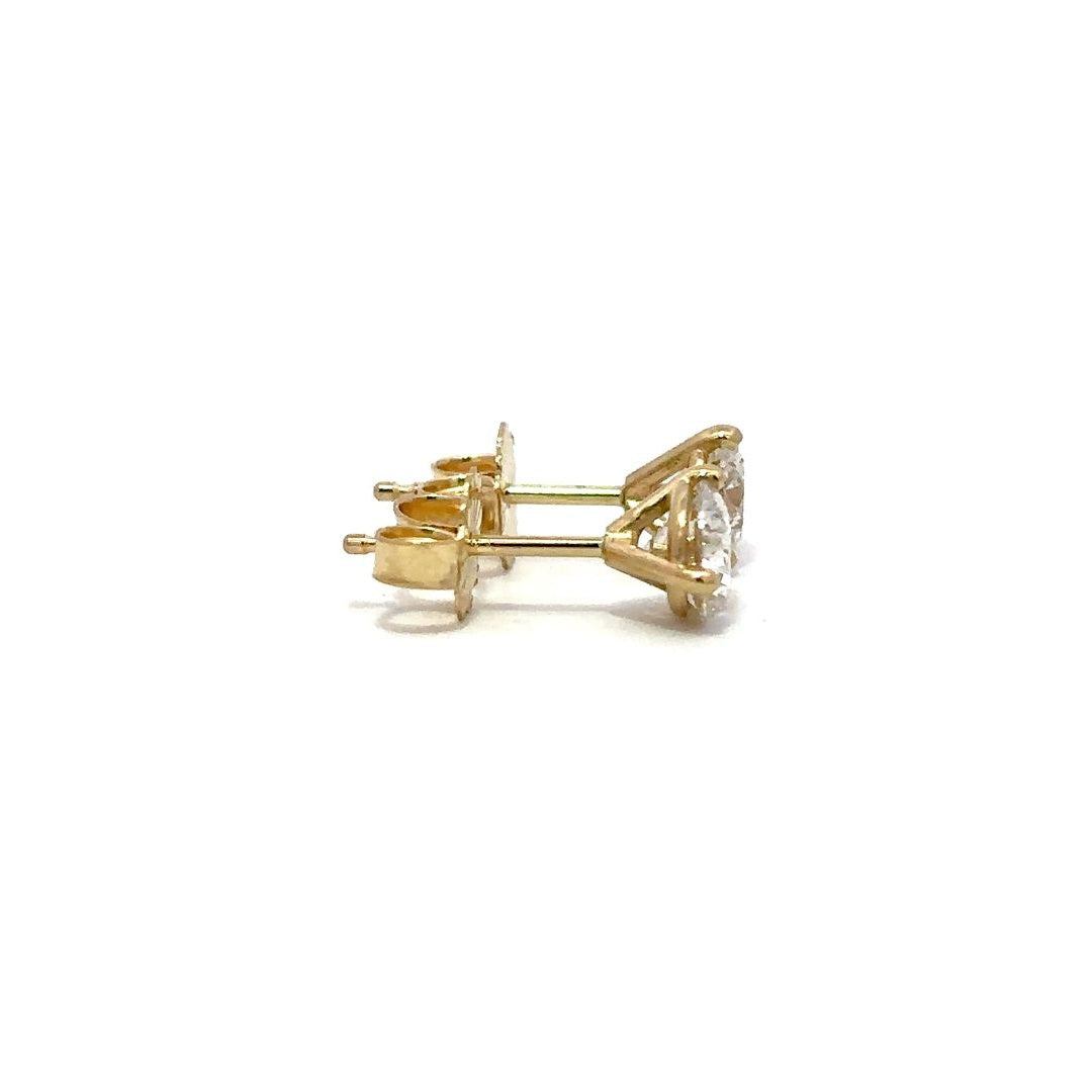 Yellow gold diamond stud earrings on a white background