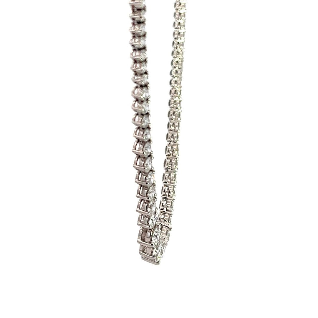 White gold diamond tennis necklace on a white background.