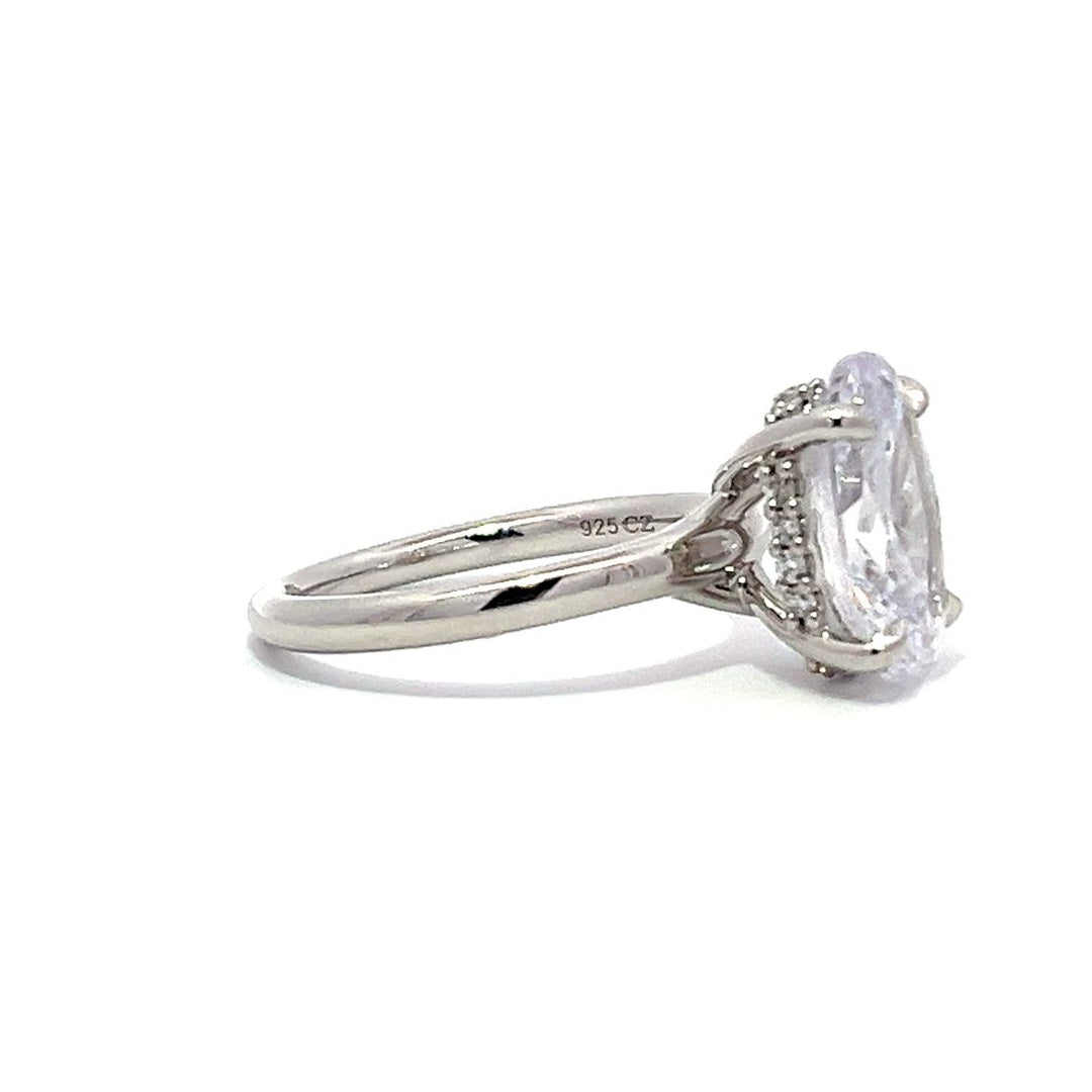 White gold round diamond solitaire engagement ring on a white background