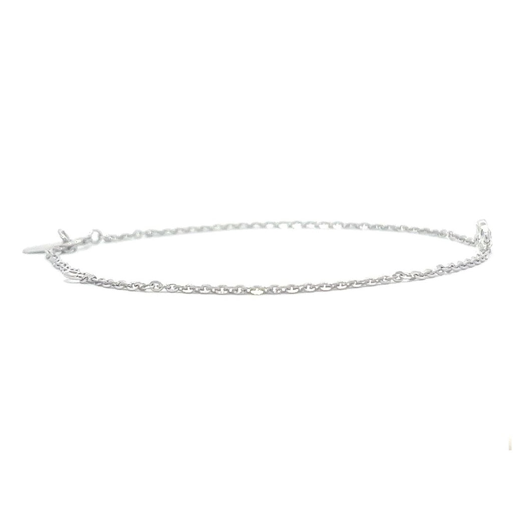 Silver bracelet with a single diamond pendant on a white background.