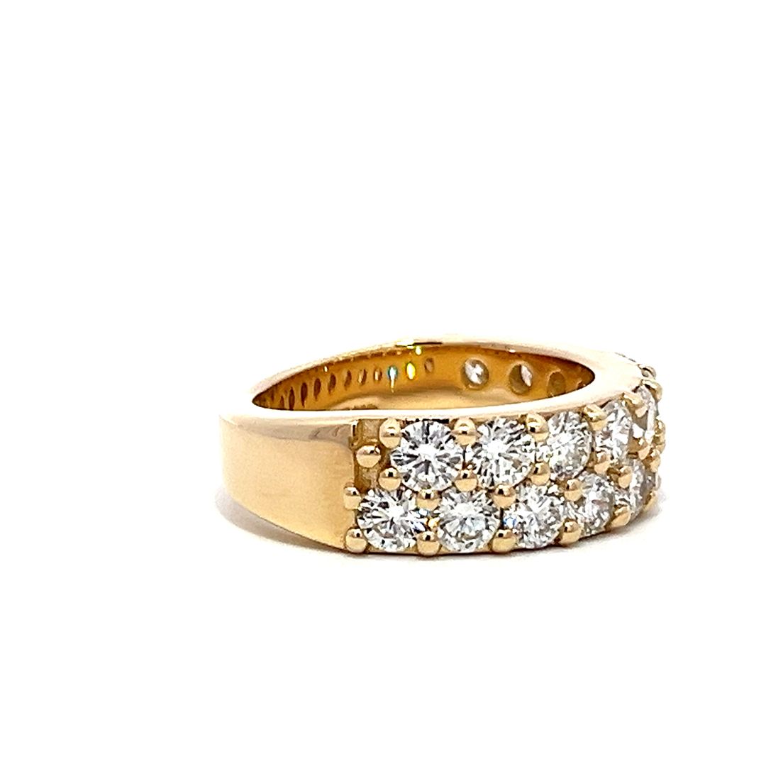 Yellow gold eternity band with two rows of pave-set diamonds on a white background.