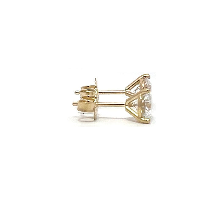 Yellow gold stud earrings with round diamonds on a white background.