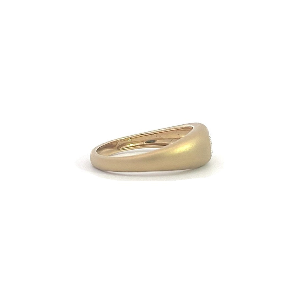 Yellow gold ring with an emerald-cut diamond set in a matte gold band, on a white background.