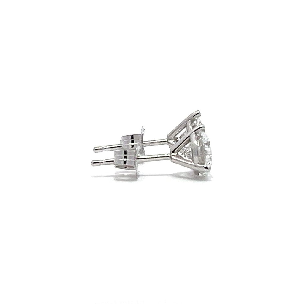 White gold stud earrings with round diamonds on a white background.