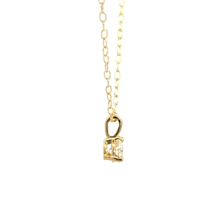 Yellow gold diamond necklace on a white background.