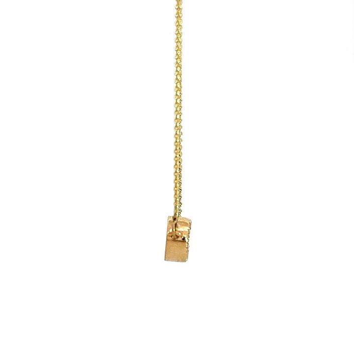 Yellow gold necklace with an oval-shaped diamond pendant on a white background.