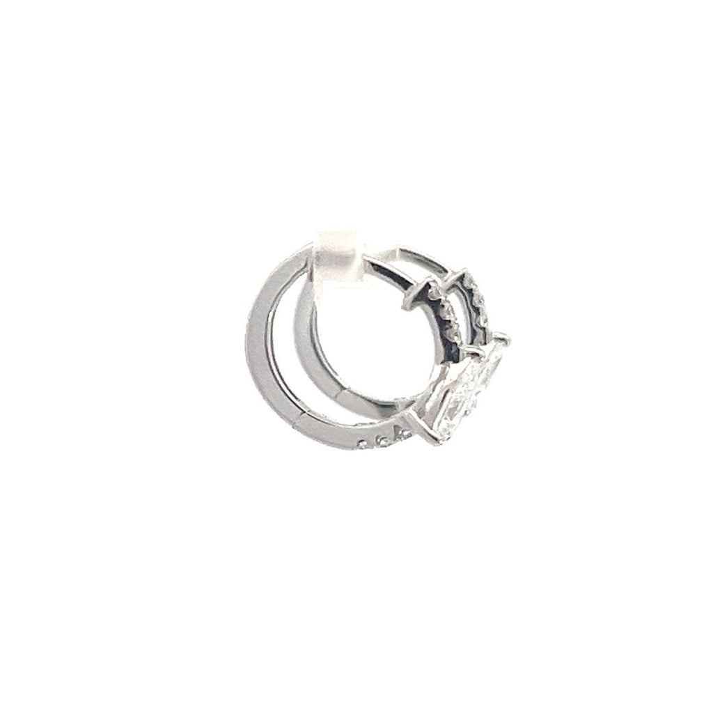 SIlver hoop earrings with round diamonds on a white background.