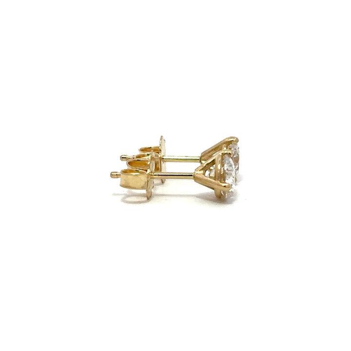 Yellow gold diamond stud earrings on a white background.*