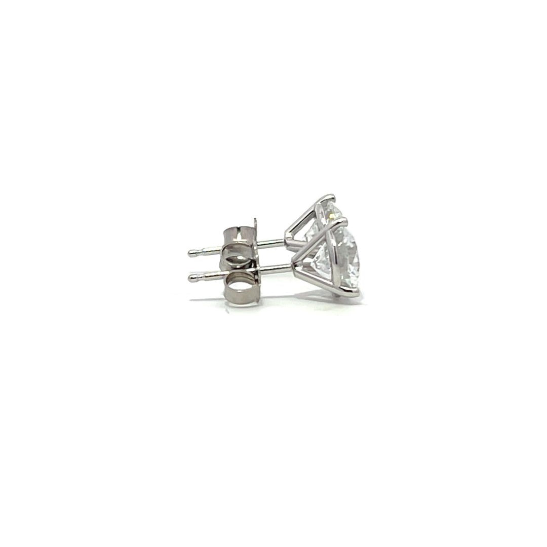 White gold stud earrings with round diamonds on a white background.