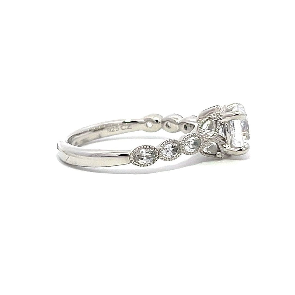 White gold diamond engagement ring with a diamond band on a white background