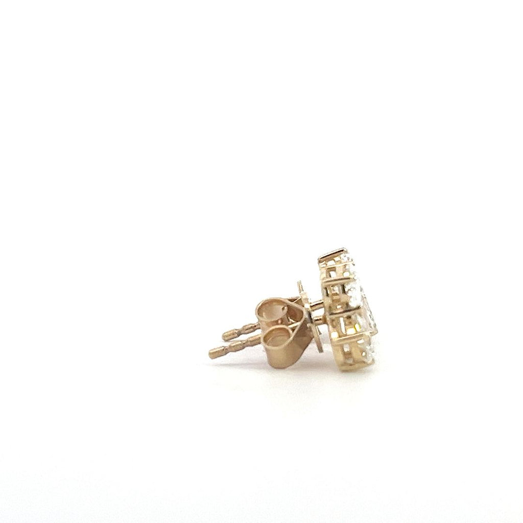 Yellow gold stud earrings with multiple diamond clusters featuring round, pear, and emerald-cut stones, on a white background.