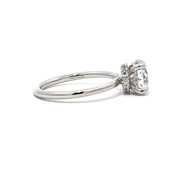 White gold diamond solitaire engagement ring on a white background.