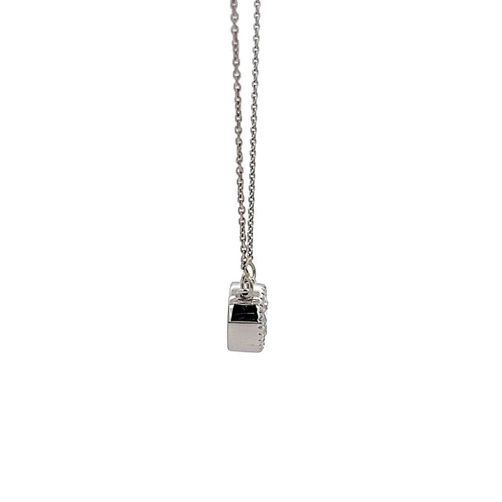 White gold necklace with a round diamond solitaire pendant on a white background.