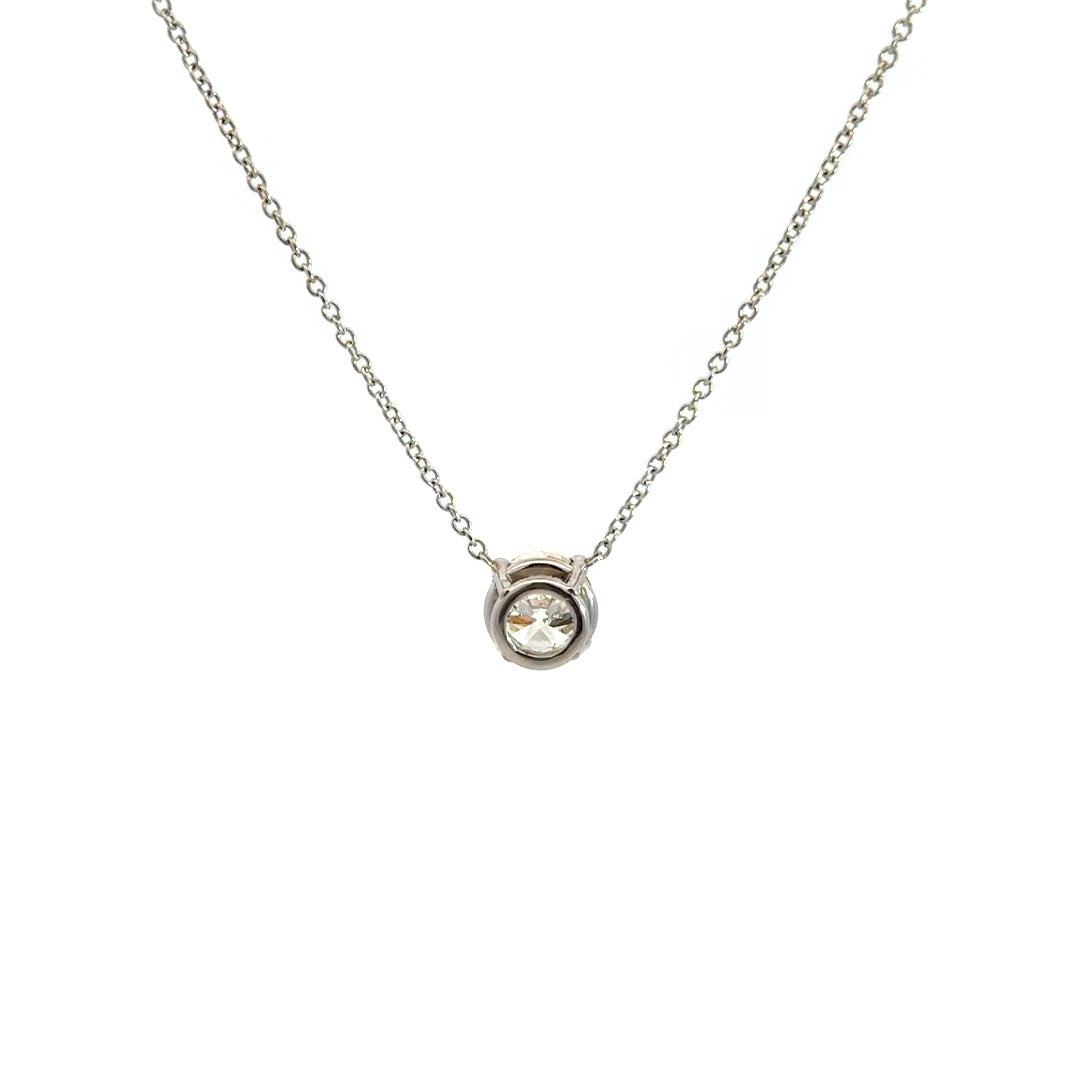 Diamond solitaire necklace on a white background.