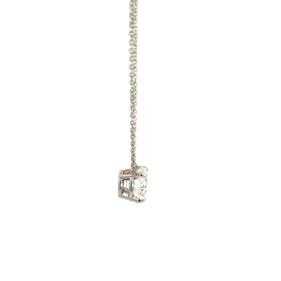 Diamond solitaire necklace on a white background.