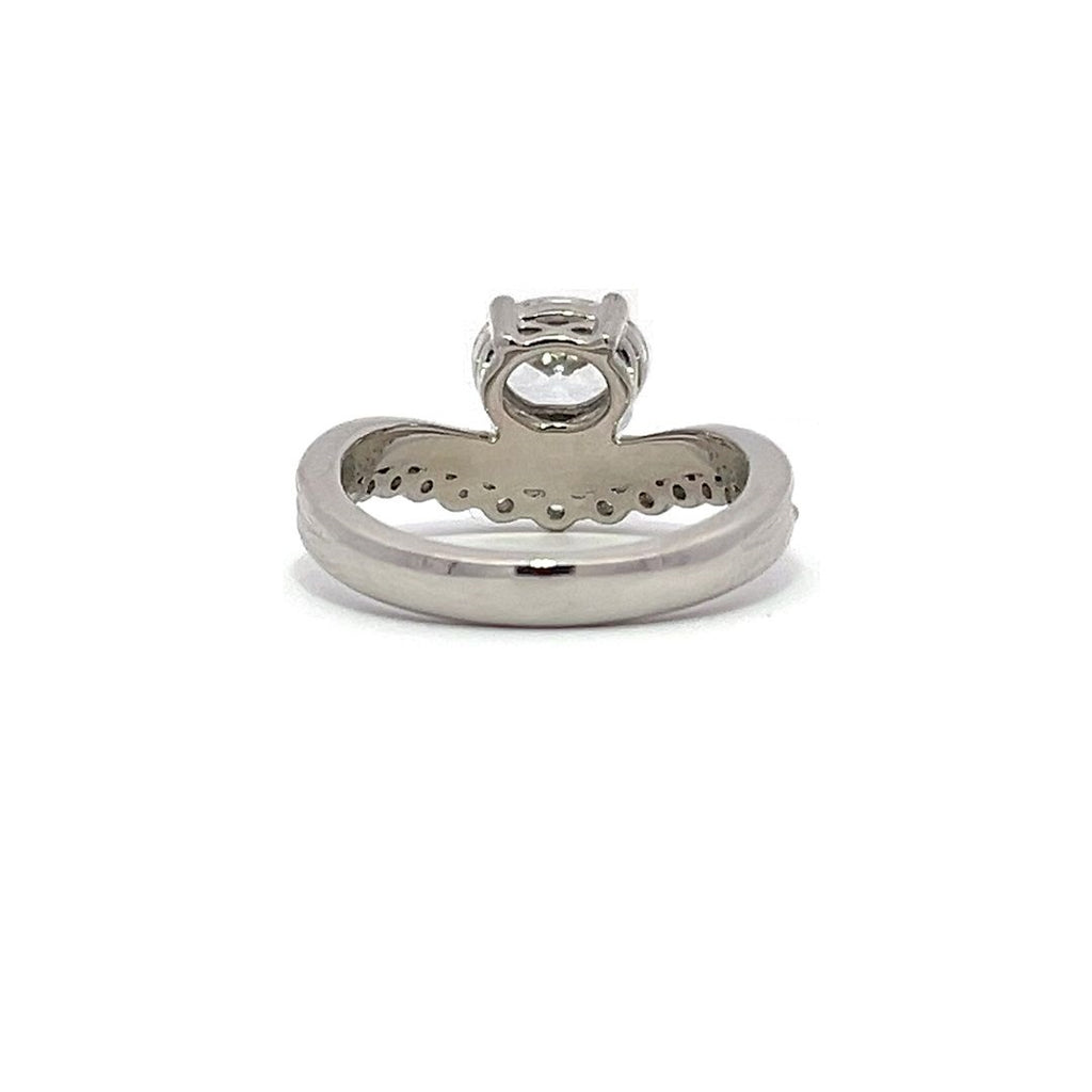 White gold diamond engagement ring set with a matching wedding band on a white background.