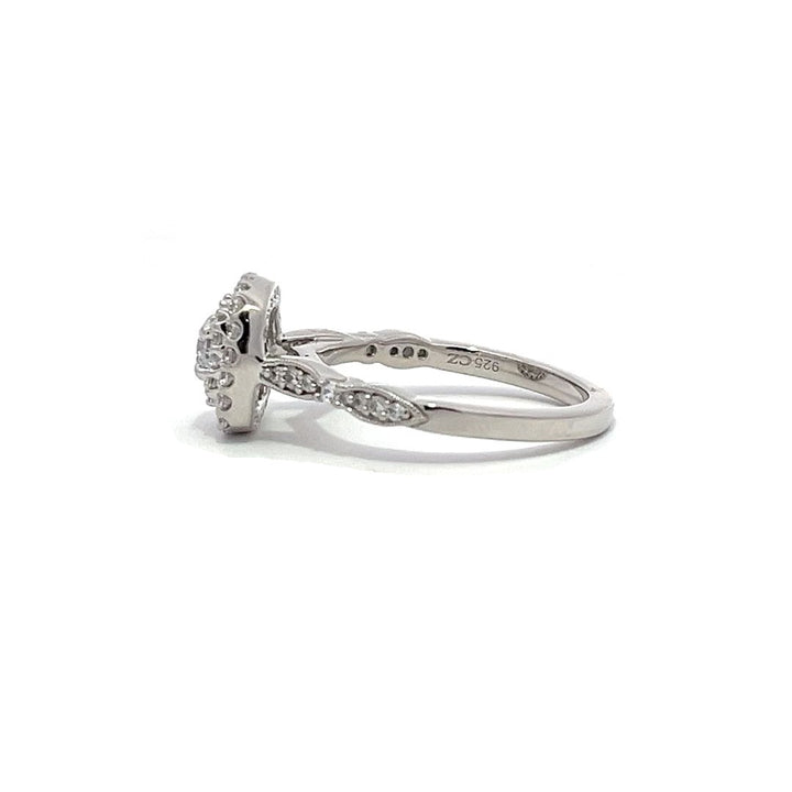 White gold diamond engagement ring with a double halo setting on a white background.