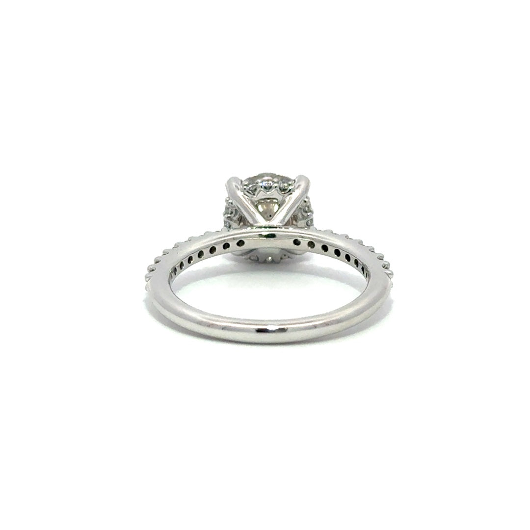 Back view of silver engagement ring with a center round cut diamond.