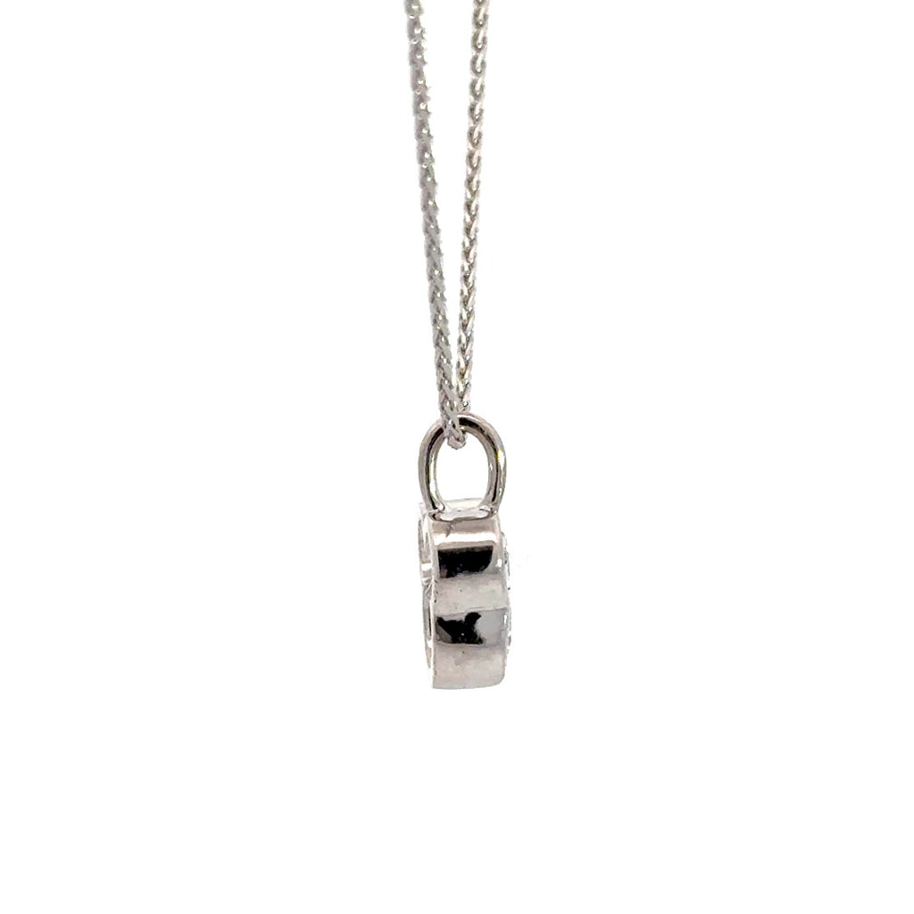 Side view of silver necklace with a diamond pendant shaped like a Mickey Mouse head  in a bezel setting